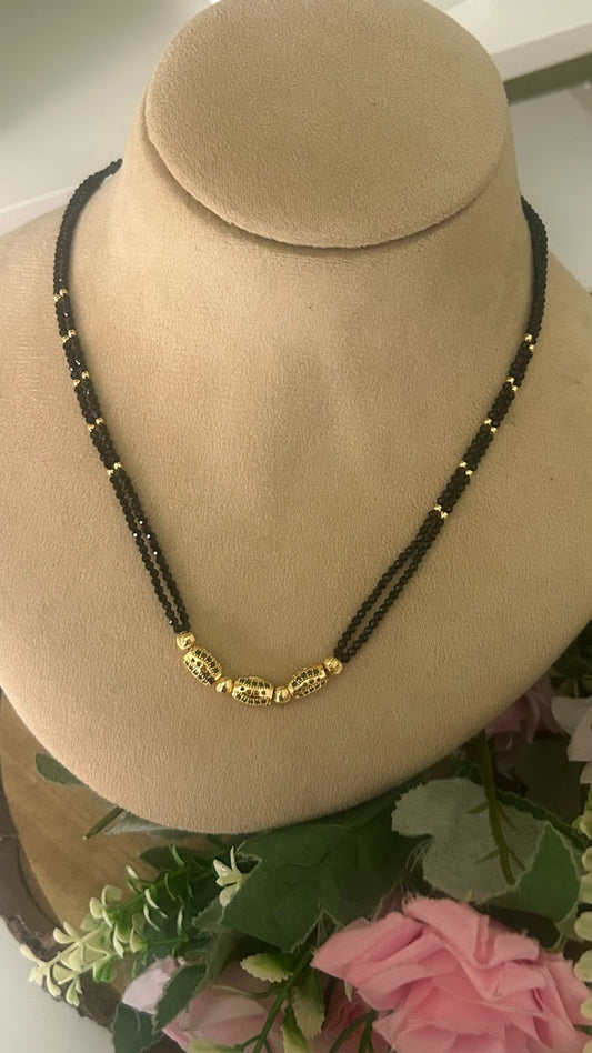 Elegant Double Line Black Beads Mangalsutra with Gold Tone Designer Filigree green Beads for Women