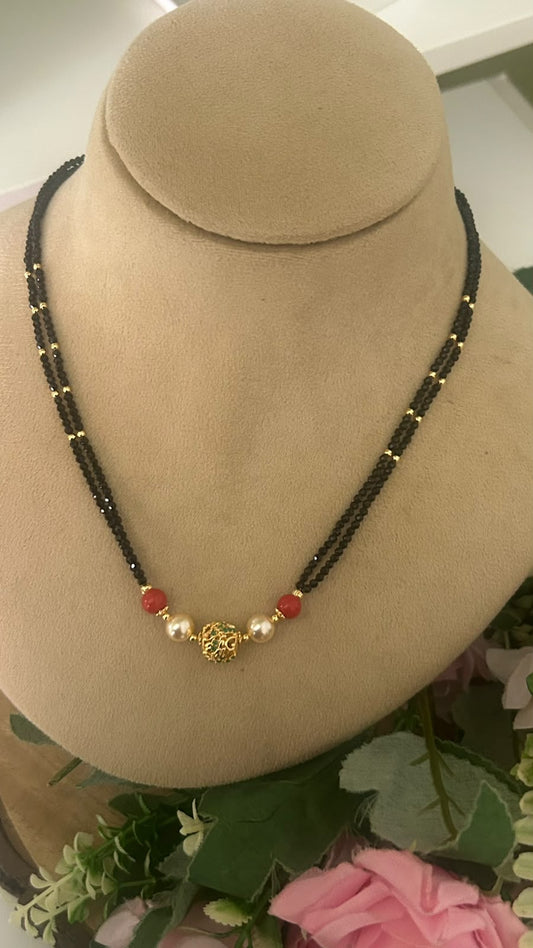 Elegant Double Line Black Beads Mangalsutra with Red Beads, Pearls & Gold Tone Designer Filigree Ball for Women