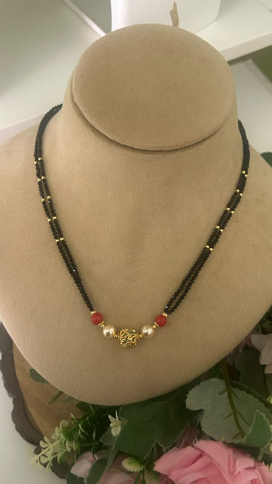 Elegant Double Line Black Beads Mangalsutra with Red Beads, Pearls & Gold Tone Designer Filigree Ball for Women