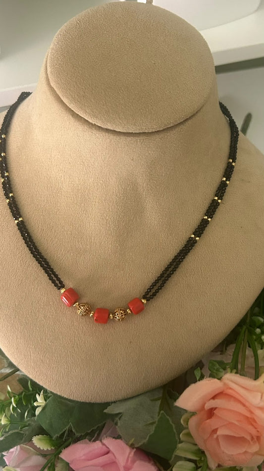 Trendy Double Line Black Beads Mangalsutra with Red Coral Style Beads & Antique Gold Tone Designer Balls for Women