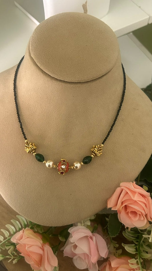 Elegant Invisible Black Beads Mangalsutra with Red Enamel Bead, Green Stones, Pearls & Antique Gold Tone Designer Accents for Women